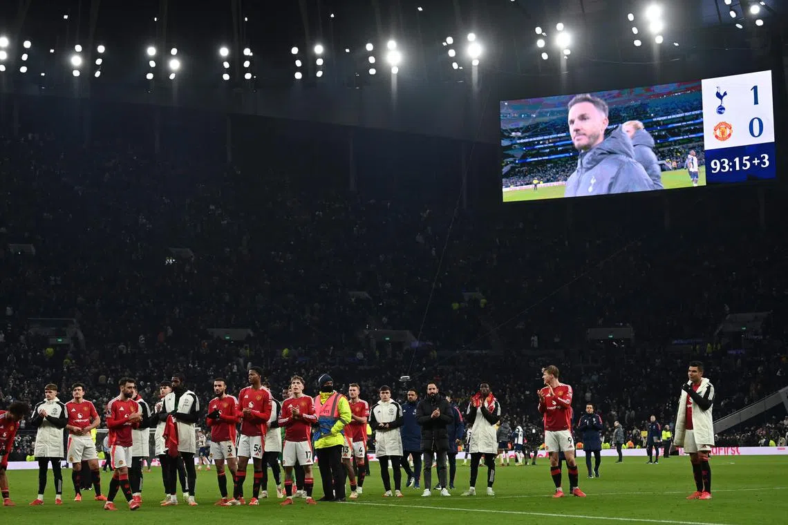Manchester United players applauding their fans after their 1-0 English Premier League away loss to Tottenham Hotspur on Feb 16.
