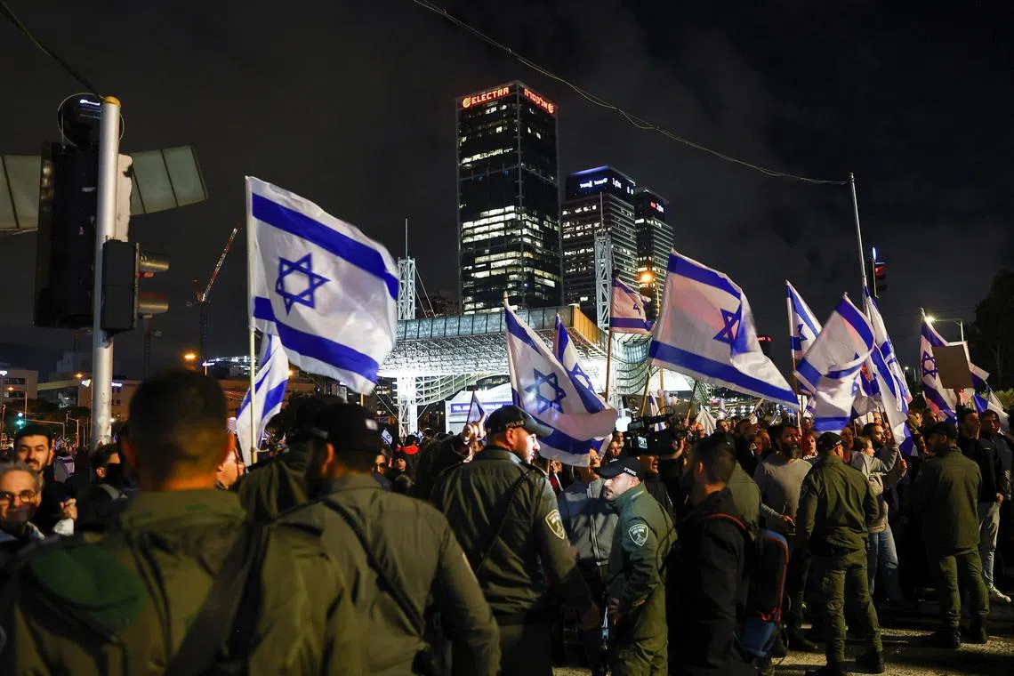 Law enforcement officers line up in Tel Aviv, as people protest against planned judicial reforms in Israel, on Feb 4, 2023.