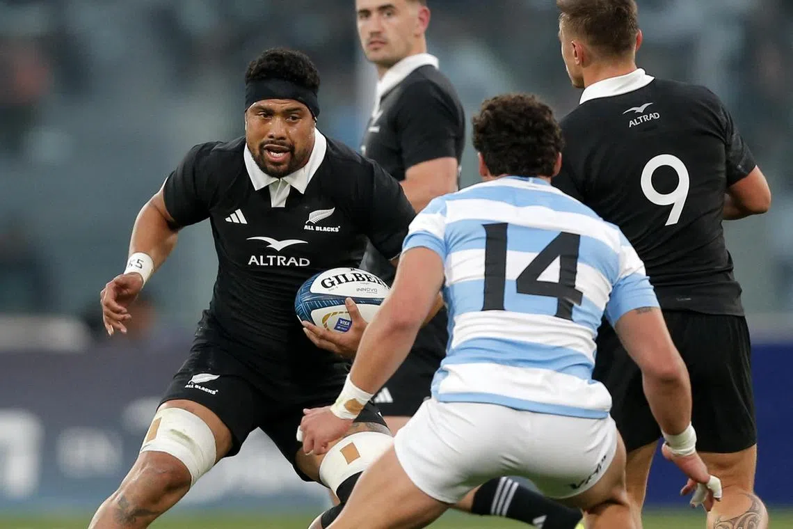 New Zealand's No. 8 Ardie Savea faces Argentina's wing Rodrigo Isgro in the Rugby Championship match at Mario Alberto Kempes stadium in Cordoba, Argentina on Aug 16, 2025.