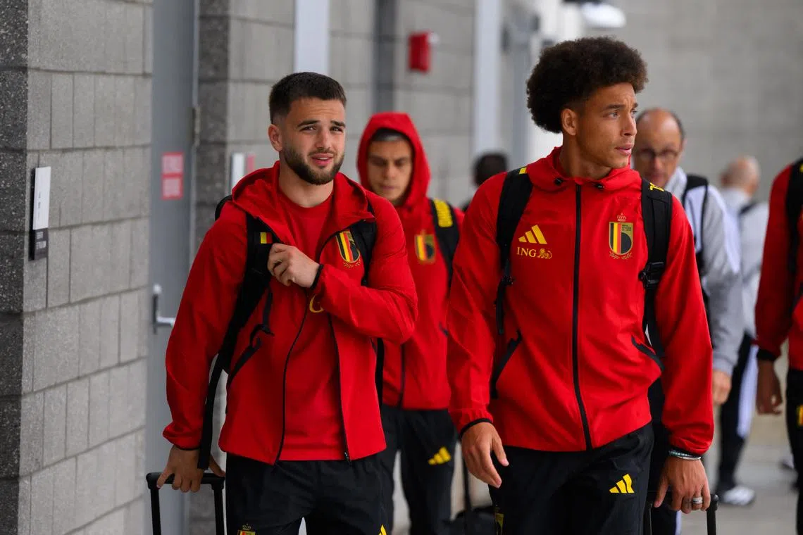 Jun 8, 2026; Seattle, Washington, USA; Belgium men's national team players Nicolas Raskin and Axel Witsel arrive for the 2026 FIFA World Cup at Seattle-Tacoma International Airport. Mandatory Credit: Steven Bisig-Imagn Images