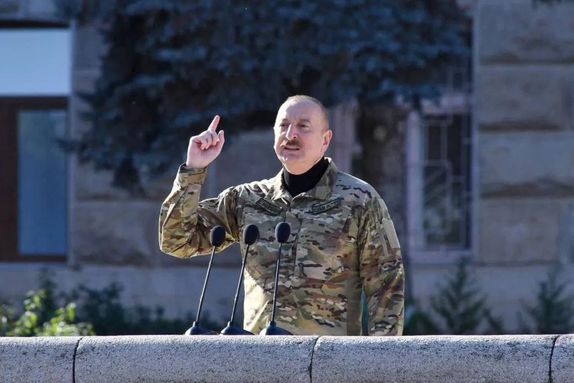 Azerbaijan's President Ilham Aliyev speaks during a military parade in Nagorno-Karabakh region's capital city on Nov 8, 2023.  President of the Republic of Azerbaijan/Handout via REUTERS/File Photo