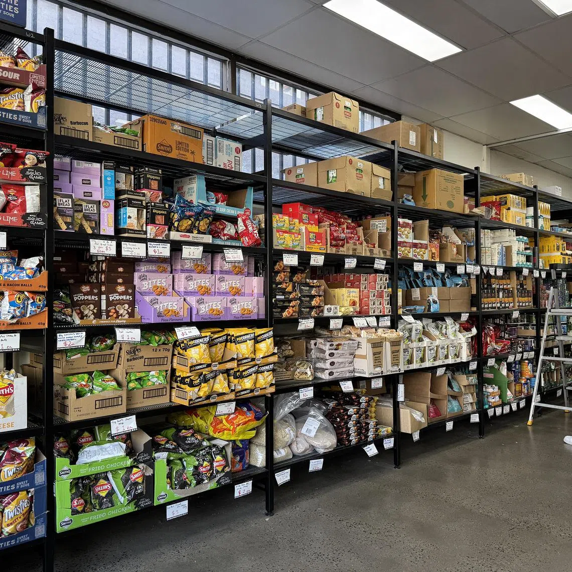 Shelves stocked with cheap snacks from as little as A$1 a pack.