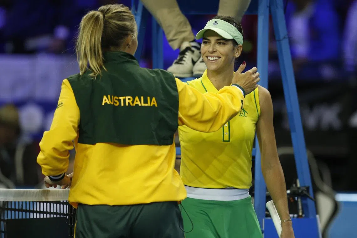 Australia's Ajla Tomljanovic celebrating with captain Alicia Molik after winning her group stage match against Slovakia's Anna Karolina Schmiedlova in Glasgow on Tuesday.