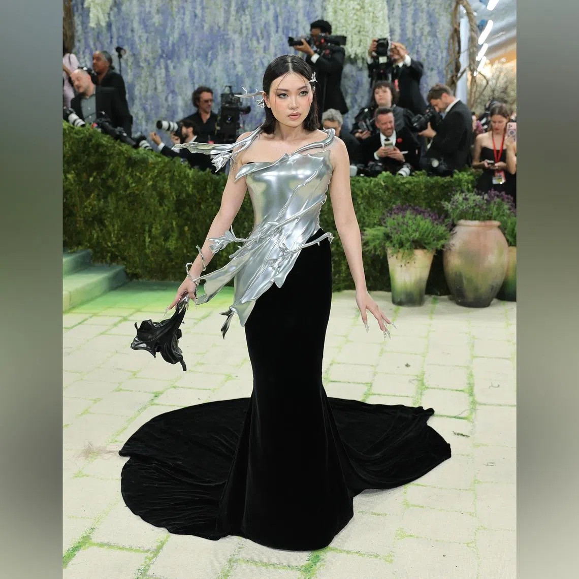 Grace Ling wore an aluminium breastplate by her namesake label and custom shoes by Singaporean footwear brand Charles & Keith. 