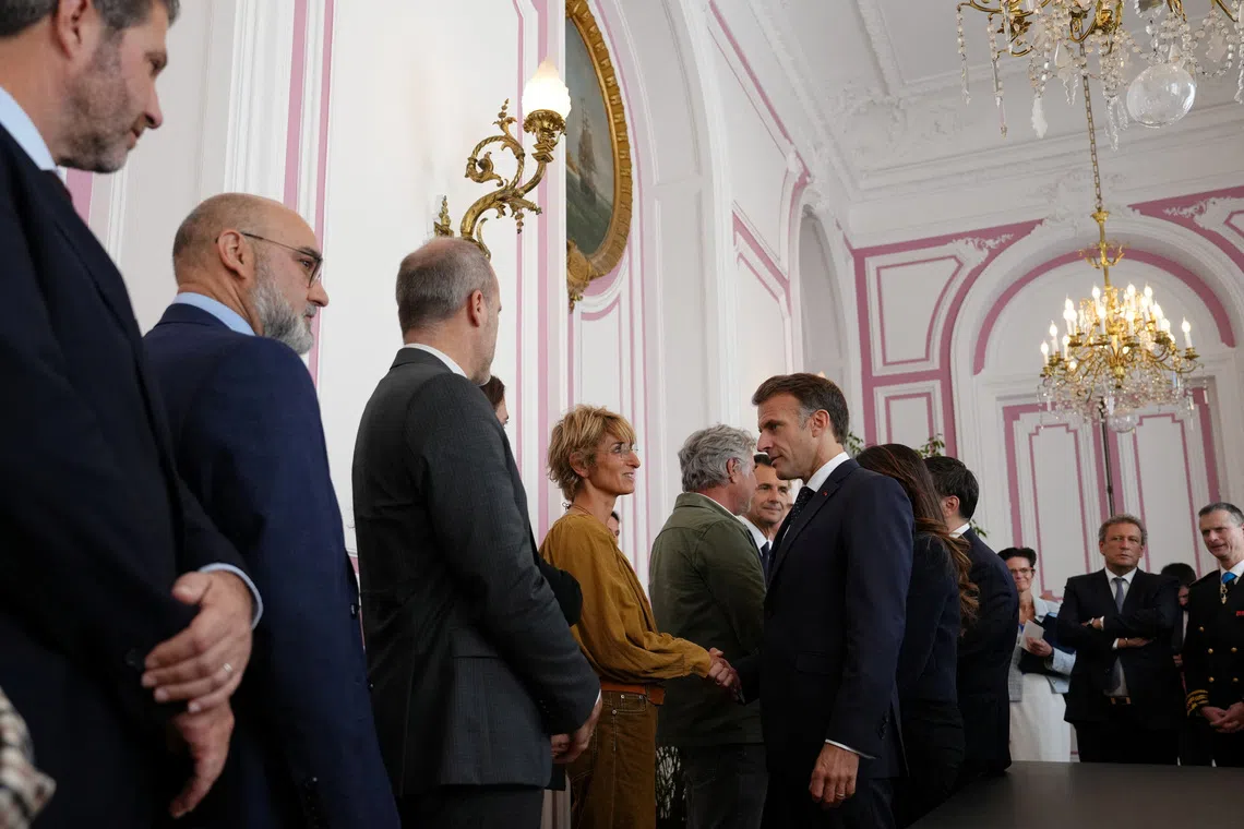 French President Emmanuel Macron meets with business owners whose businesses were damaged during recent riots in Marseille, France, October 26, 2026. Aurelien Morissard/Pool via REUTERS