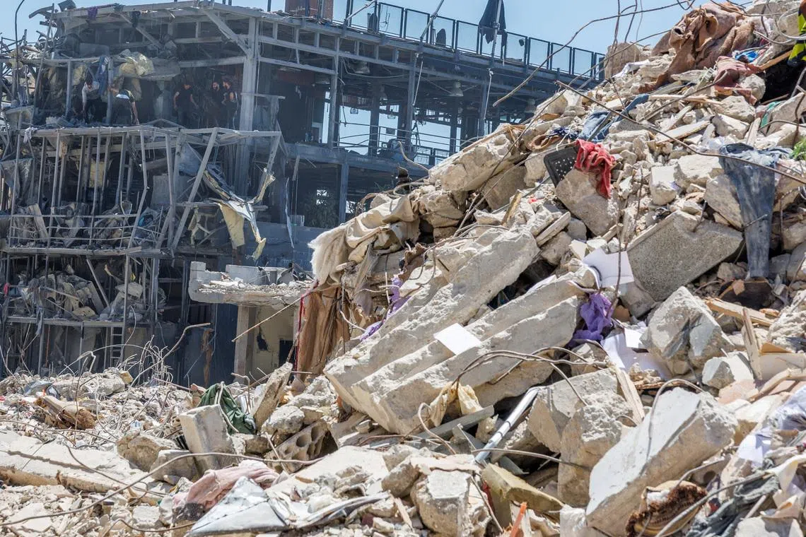 Workers clean a restaurant that was damaged by an Israeli strike, amid a temporary ceasefire between Lebanon and Israel, in Tyre, Lebanon, April 23, 2026. REUTERS/Zohra Bensemra/File Photo