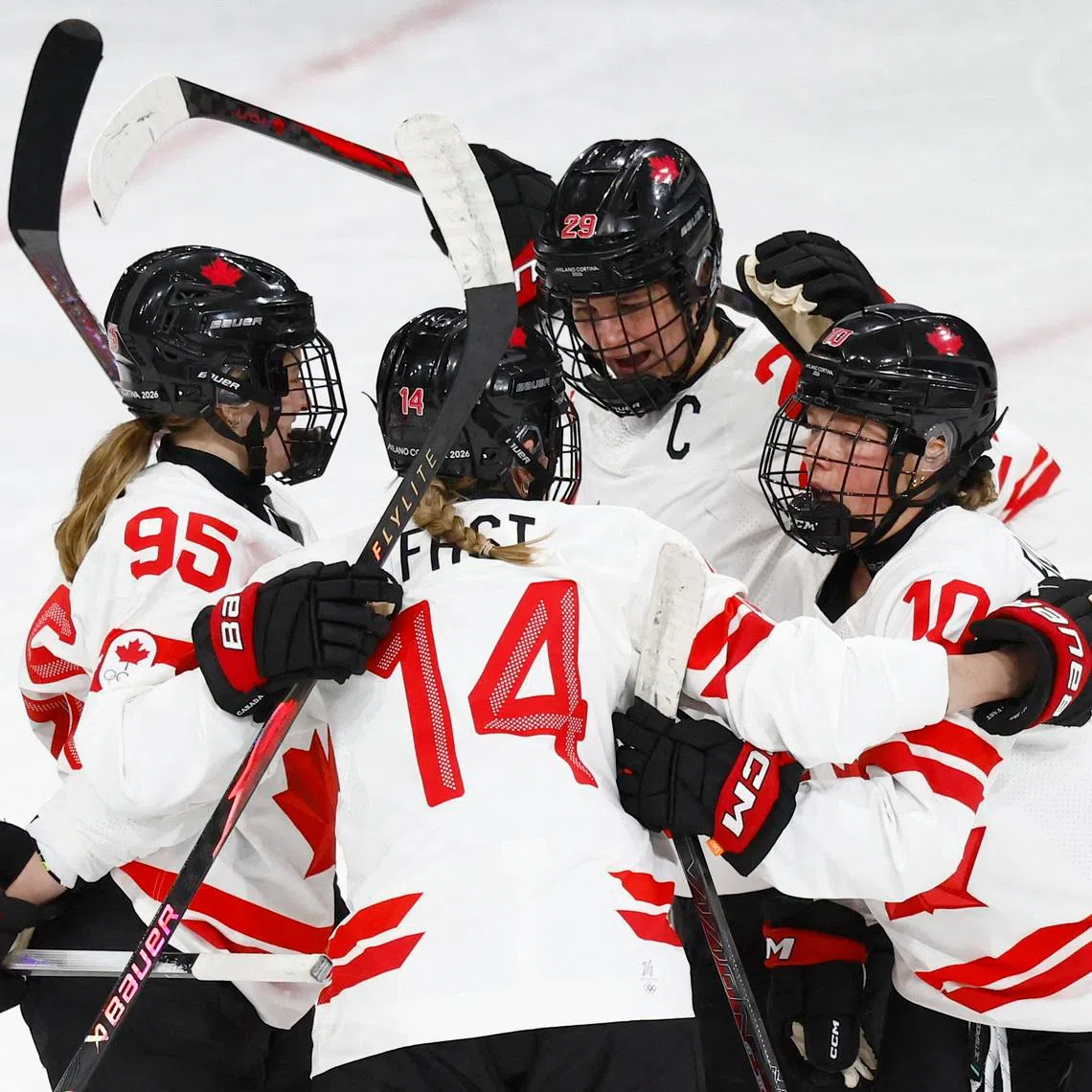 Milano Cortina 2026 Olympics - Ice Hockey - Women's Preliminary Round - Group A - Switzerland vs Canada - Milano Rho Ice Hockey Arena, Milan, Italy - February 07, 2026. Natalie Spooner of Canada celebrates scoring their first goal against Switzerland with teammates REUTERS/Alessandro Garofalo