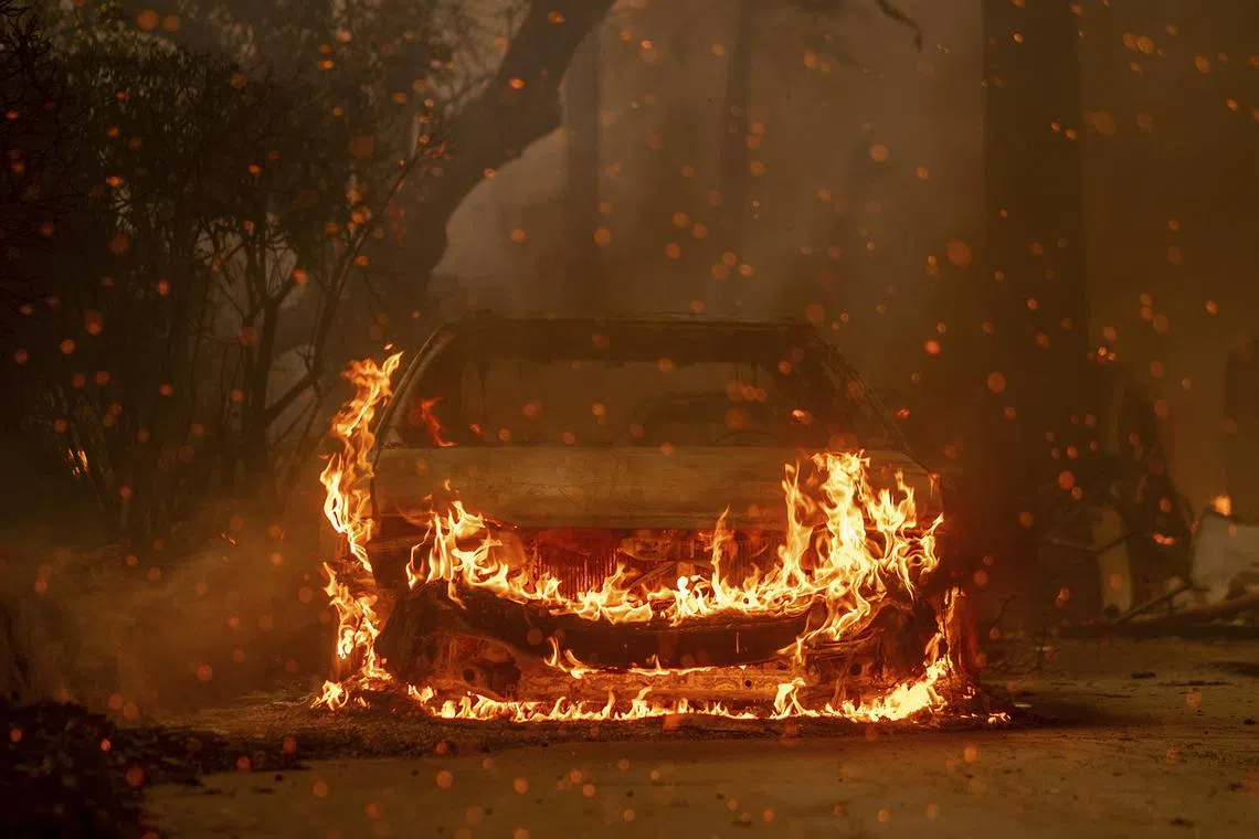 A car burns during the Eaton Fire in Los Angleles county on Wednesday, Jan 8, 2025. 