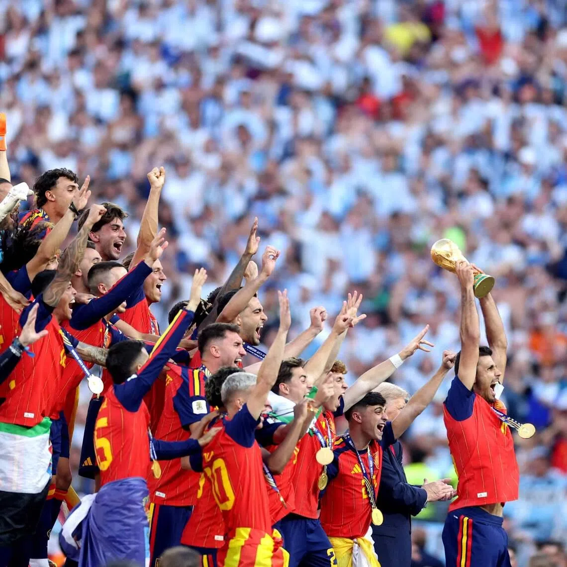 EAST RUTHERFORD, NEW JERSEY - JULY 19: Rodri #16 of Spain lifts the FIFA World Cup Winners Trophy after the teams victory following the FIFA World Cup 2026 Final match between Spain and Argentina at New York New Jersey Stadium on July 19, 2026 in East Rutherford, New Jersey.   Lars Baron/Getty Images/AFP (Photo by Lars Baron / GETTY IMAGES NORTH AMERICA / Getty Images via AFP)
