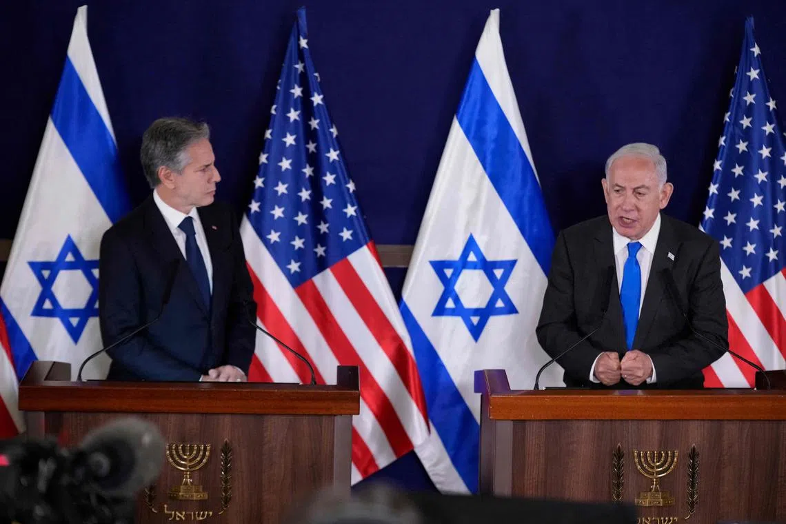 US Secretary of State Antony Blinken (left) looks on as Israeli Prime Minister Benjamin Netanyahu gives a statement to the media, in Tel Aviv.