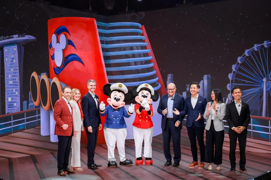 Transport Minister and Minister-in-charge of Trade Relations S Iswaran (4th from right), Chairman, Disney Parks, Experiences and Products Josh D'Amaro (3rd from left), Minister of State for Trade and Industry and Culture, Community and Youth Alvin Tan (3rd from left), Singapore Tourism Board chief executive Keith Tan and guests at the launch of a new partnership between Disney Cruise Line and the Singapore Tourism Board held at the Hybrid Event Broadcast Studio at Sands Expo and Convention Centre, March 29, 2023.