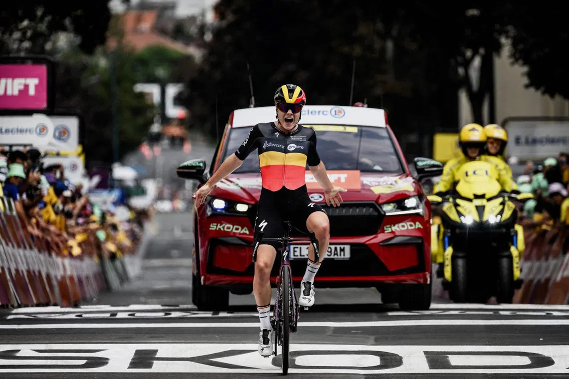 Team SD Worx's Belgian rider Lotte Kopecky reacts as she crosses the finish line to win the first stage.