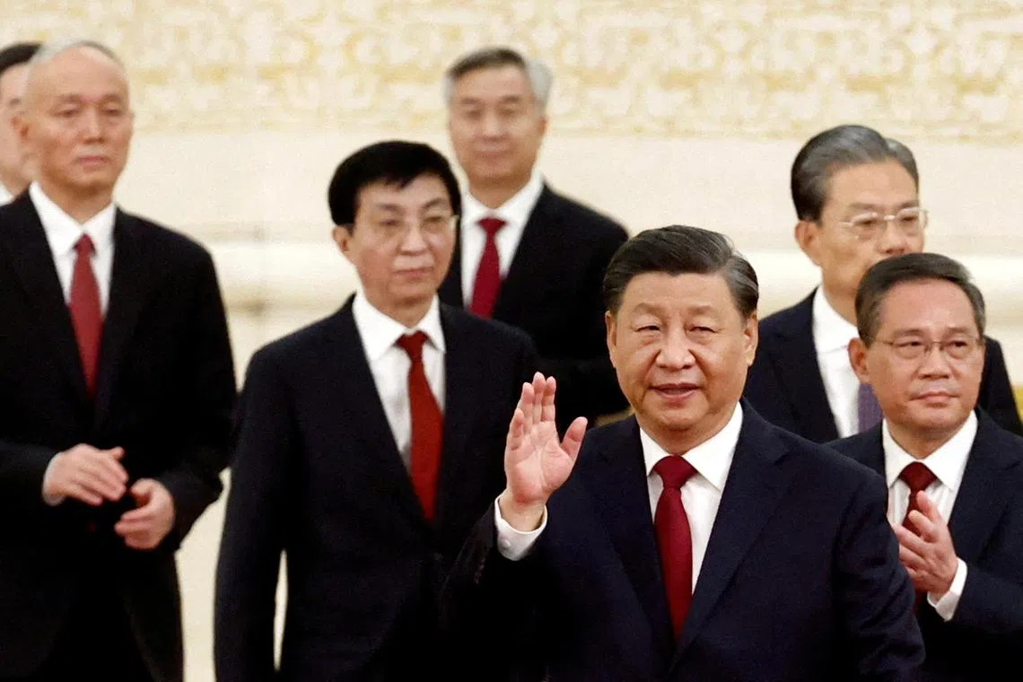FILE PHOTO: New Politburo Standing Committee members Xi Jinping, Li Qiang, Zhao Leji, Wang Huning, Cai Qi, Ding Xuexiang and Li Xi arrive to meet the media following the 20th National Congress of the Communist Party of China, at the Great Hall of the People in Beijing, China October 23, 2022. REUTERS/Tingshu Wang/File Photo