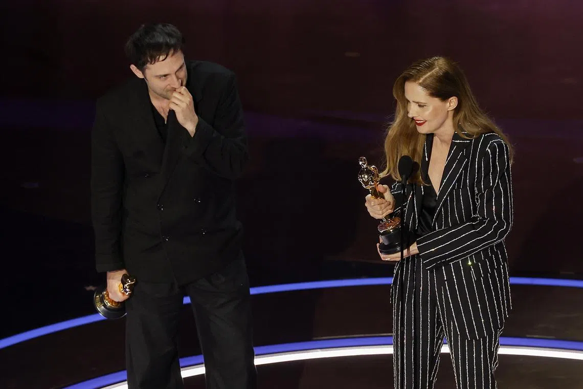epa11212932 Arthur Harari (L) and Justine Triet (R) winners of Best Original Screenplay for the movie 'Anatomy of a Fall' during the 96th annual Academy Awards ceremony at the Dolby Theatre in the Hollywood neighborhood of Los Angeles, California, USA, 10 March 2024. The Oscars are presented for outstanding individual or collective efforts in filmmaking in 23 categories.  EPA-EFE/CAROLINE BREHMAN