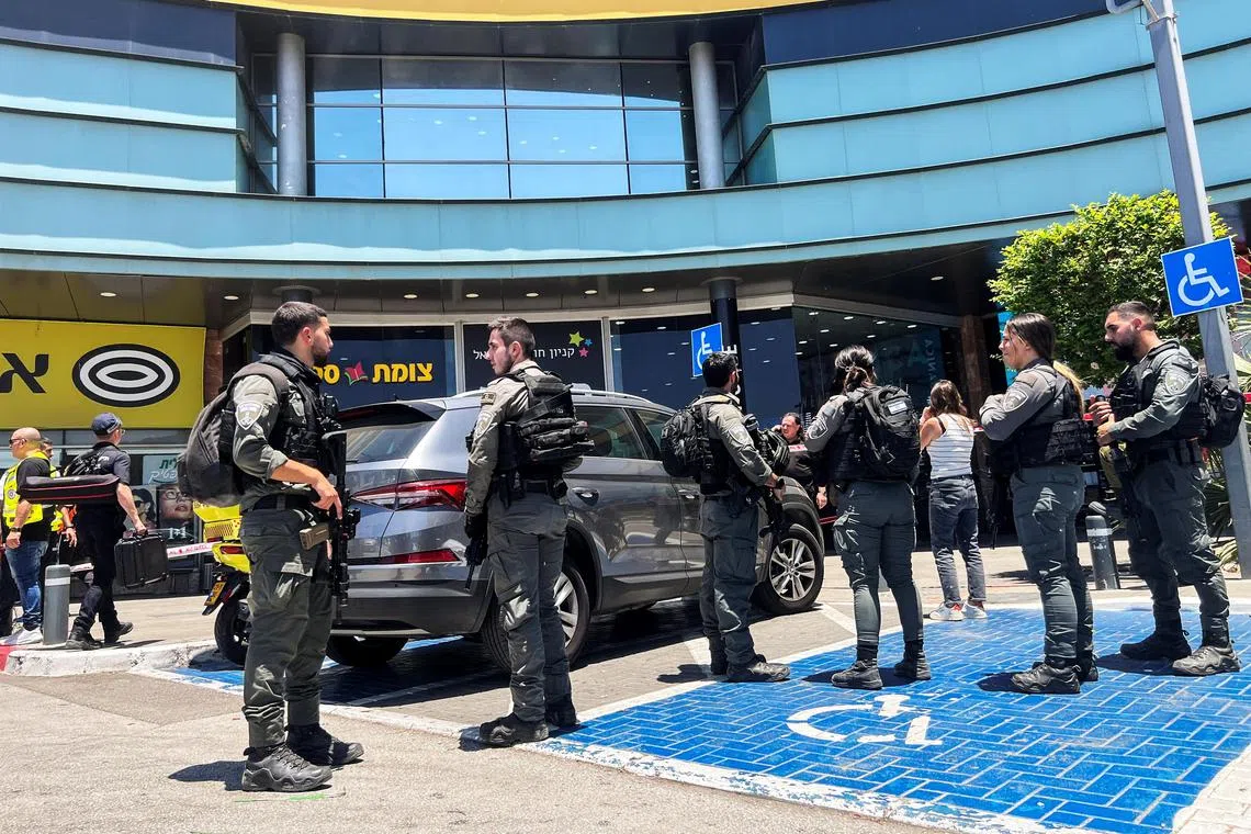 Police said they were treating the double stabbing at a mall in the northern town of Karmiel as “a suspected terror attack”.