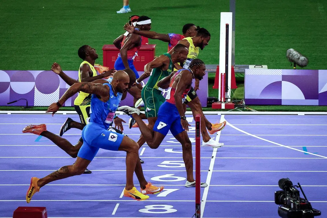 FILE PHOTO: Paris 2024 Olympics - Athletics - Men's 100m Final - Stade de France, Saint-Denis, France - August 04, 2024. Noah Lyles of United States crosses the line to win gold. REUTERS/Agustin Marcarian/File Photo