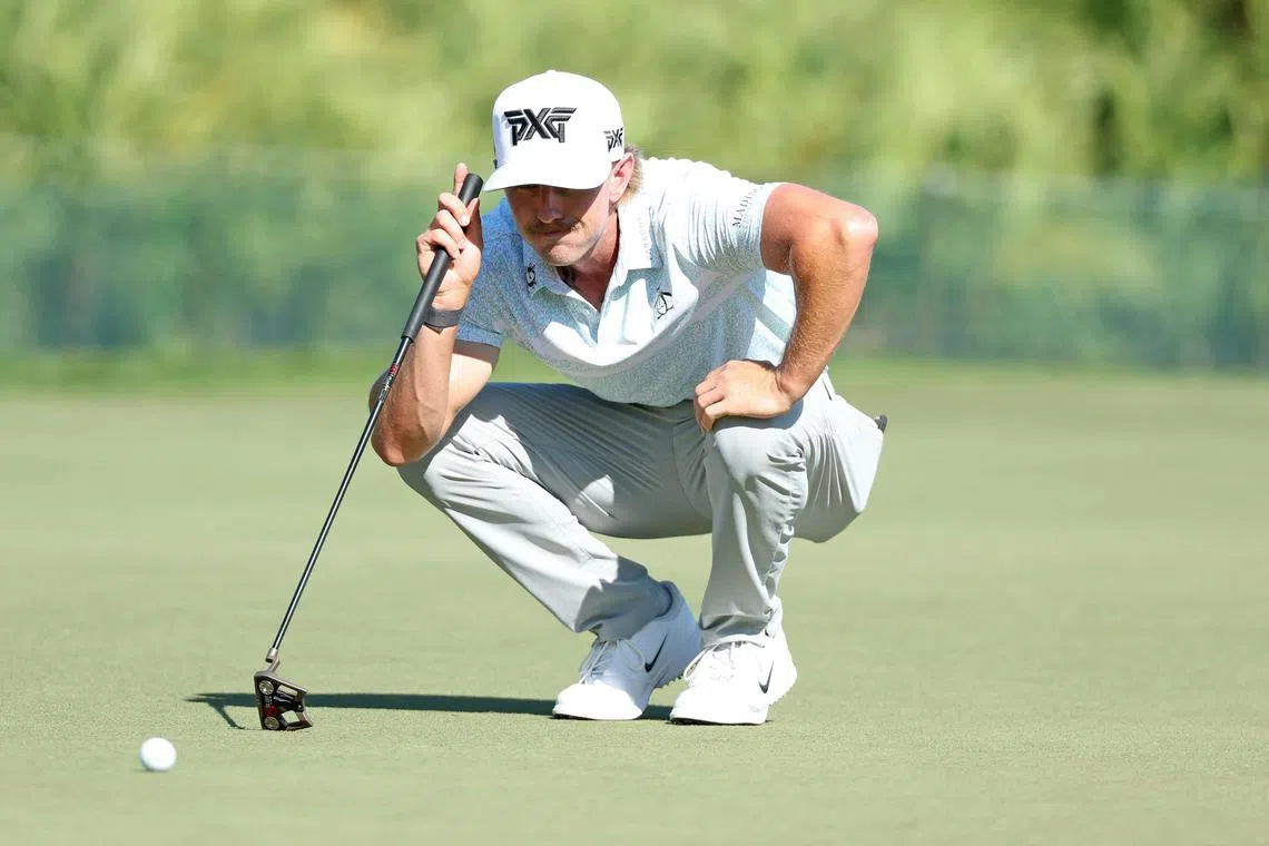 Jake Knapp of the United States lines up a putt on the second green during the second round of the Cognizant Classic.