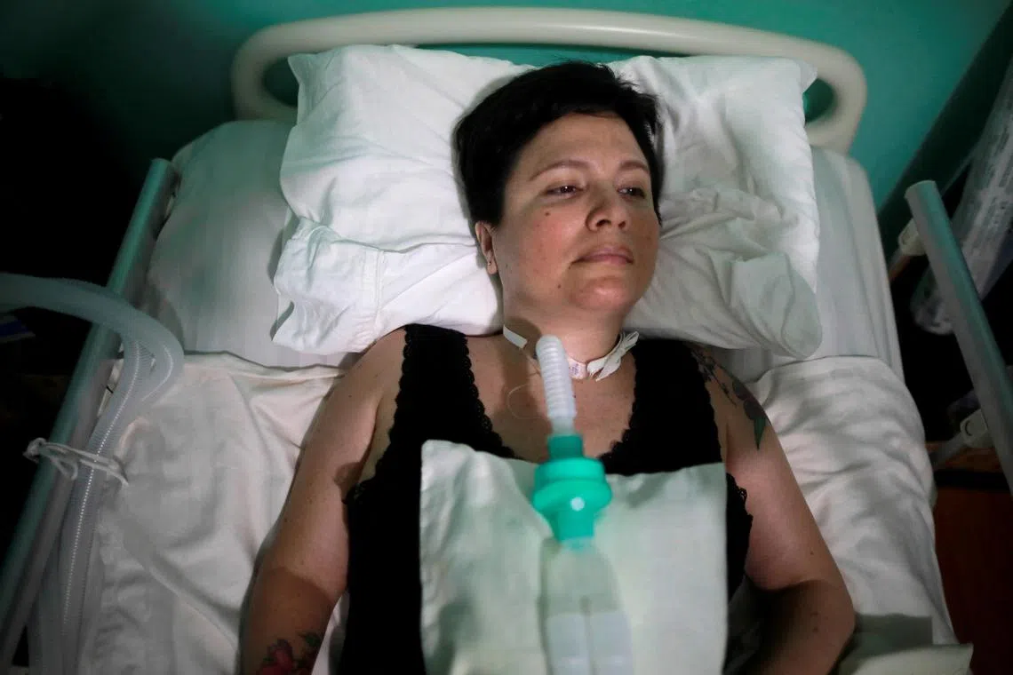 FILE PHOTO: Ana Estrada, a euthanasia advocate who suffers from an incurable condition that atrophies her muscles and has left her breathing through a ventilator, lies in bed at her home in Lima, Peru February 7, 2020. REUTERS/Sebastian Castaneda/File Photo