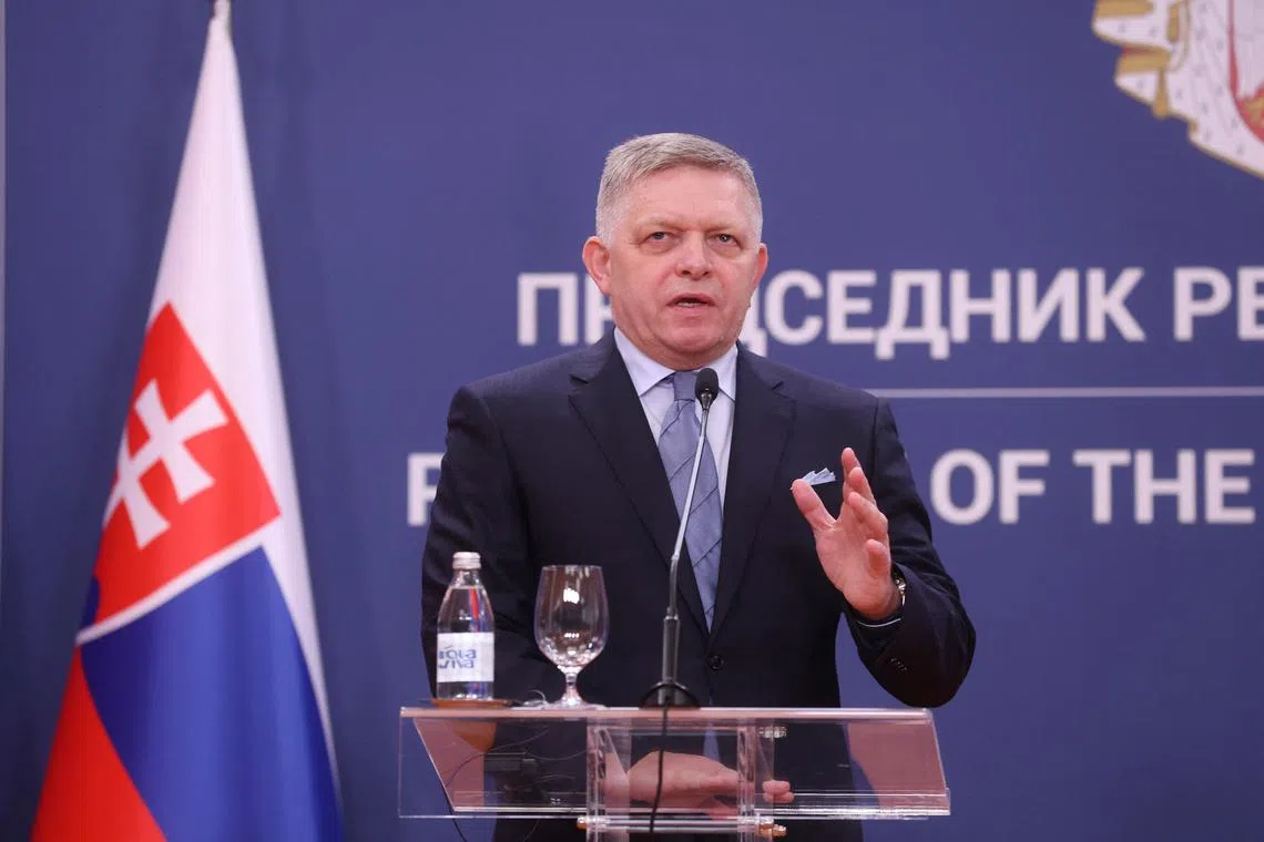 FILE PHOTO: Slovak Prime Minister Robert Fico attends a press conference with Serbian President Aleksandar Vucic (not pictured) in Belgrade, Serbia, November 21, 2024. REUTERS/Djordje Kojadinovic/File Photo