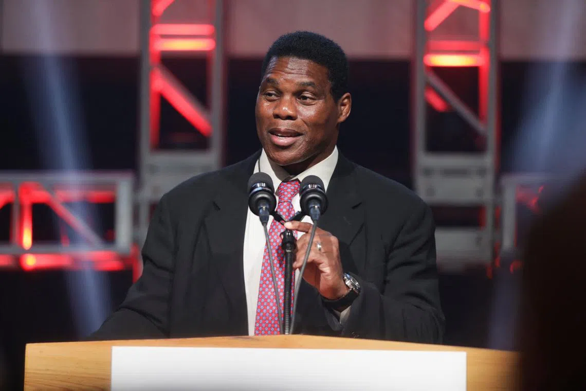 FILE PHOTO: Republican U.S. Senate candidate Herschel Walker speaks during a U.S. midterm runoff election night party in Atlanta, Georgia, U.S., December 6, 2022. REUTERS/Alyssa Pointer/File Photo