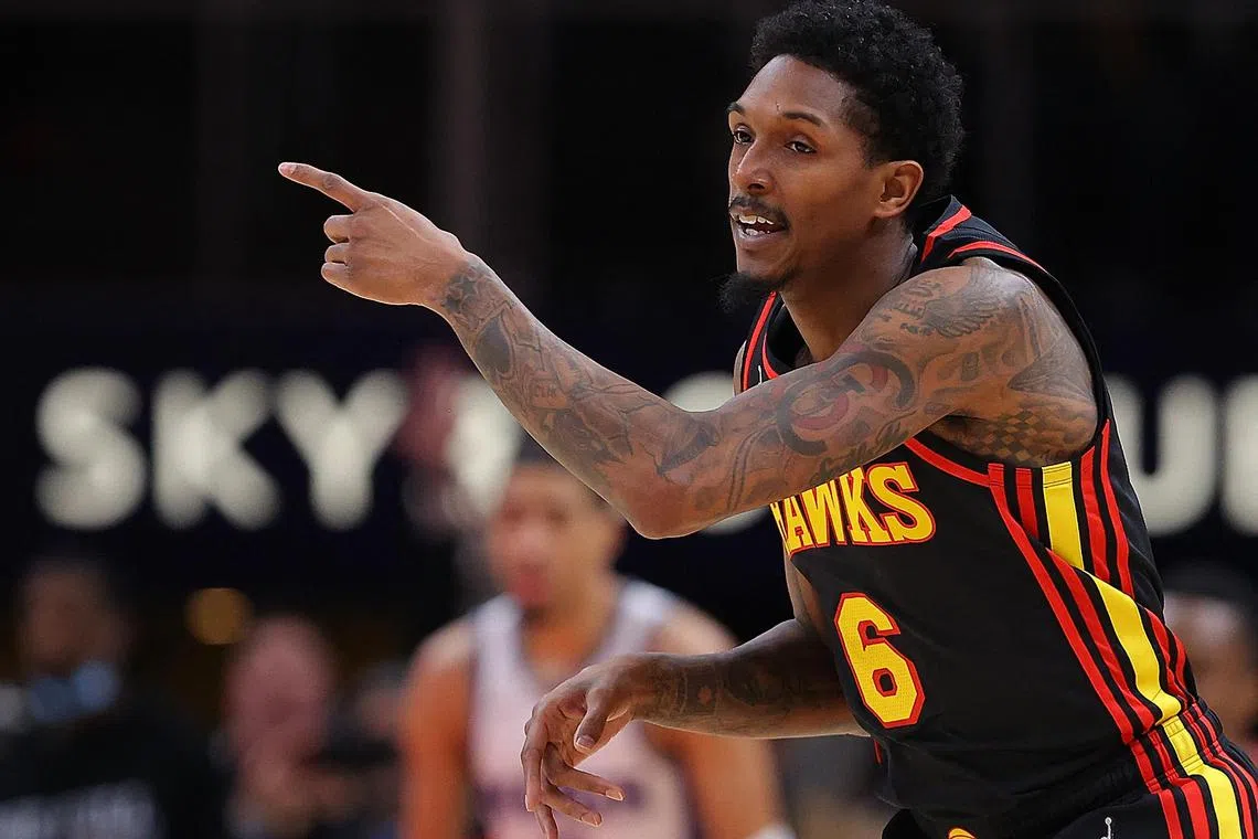(FILES) Lou Williams, #6 of the Atlanta Hawks, reacts after a three-point basket against the Sacramento Kings during the first half at State Farm Arena in Atlanta, Georgia, on January 26, 2022. Lou Williams, the NBA's all-time top reserve scorer and a three-time winner of the Sixth Man of the Year award, announced his retirement from the league on June 18, 2023, after 17 seasons. The 36-year-old guard, who did not play in the NBA this past season, saw his final league game with the Atlanta Hawks in 2022. (Photo by Kevin C. Cox / GETTY IMAGES NORTH AMERICA / AFP)