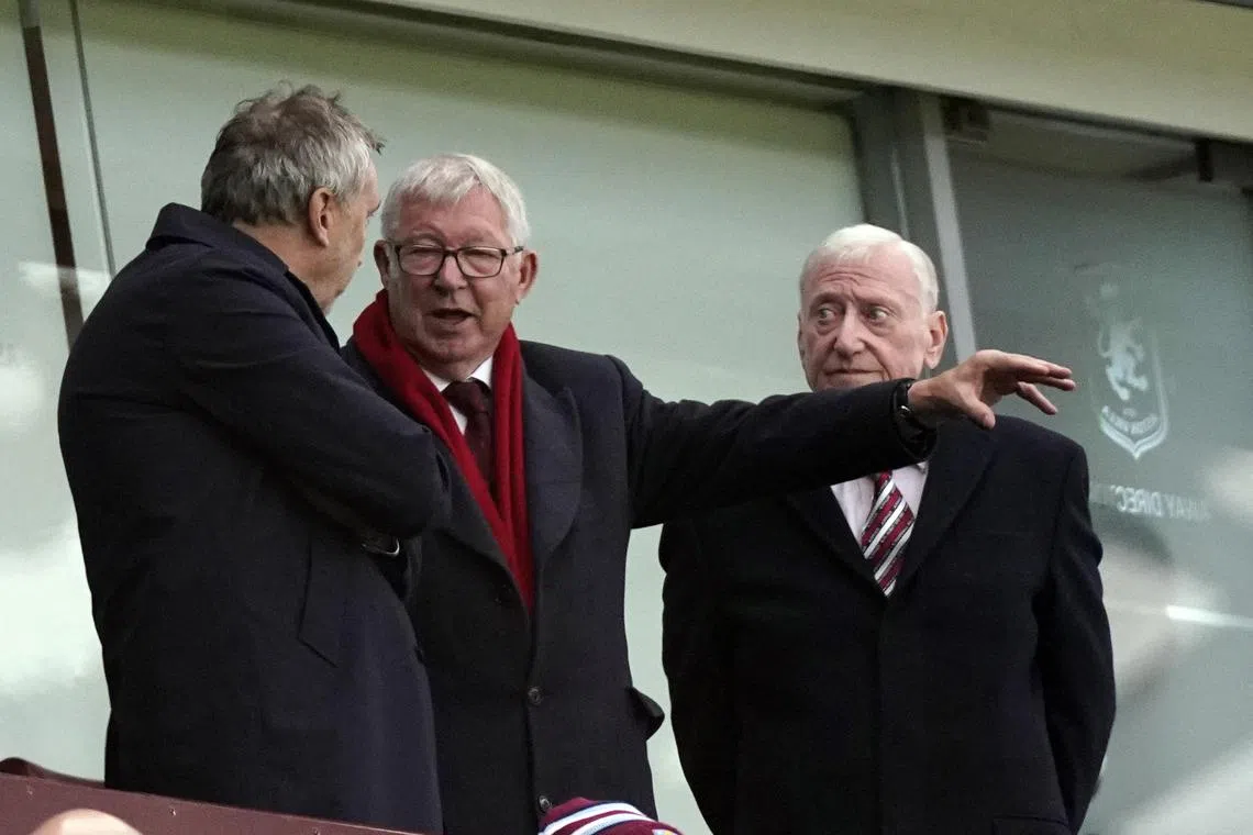 Alex Ferguson (centre) attending the English Premier League match between Aston Villa and Manchester United in Birmingham on Oct 6.