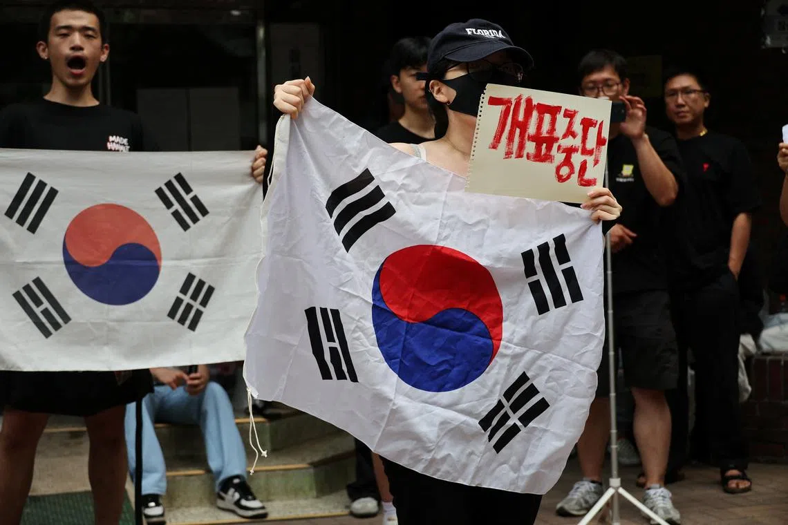 Protesters called for a halt to vote counting and a rerun of the race as they surround a polling station for local elections, in Seoul, South Korea, on June 4.