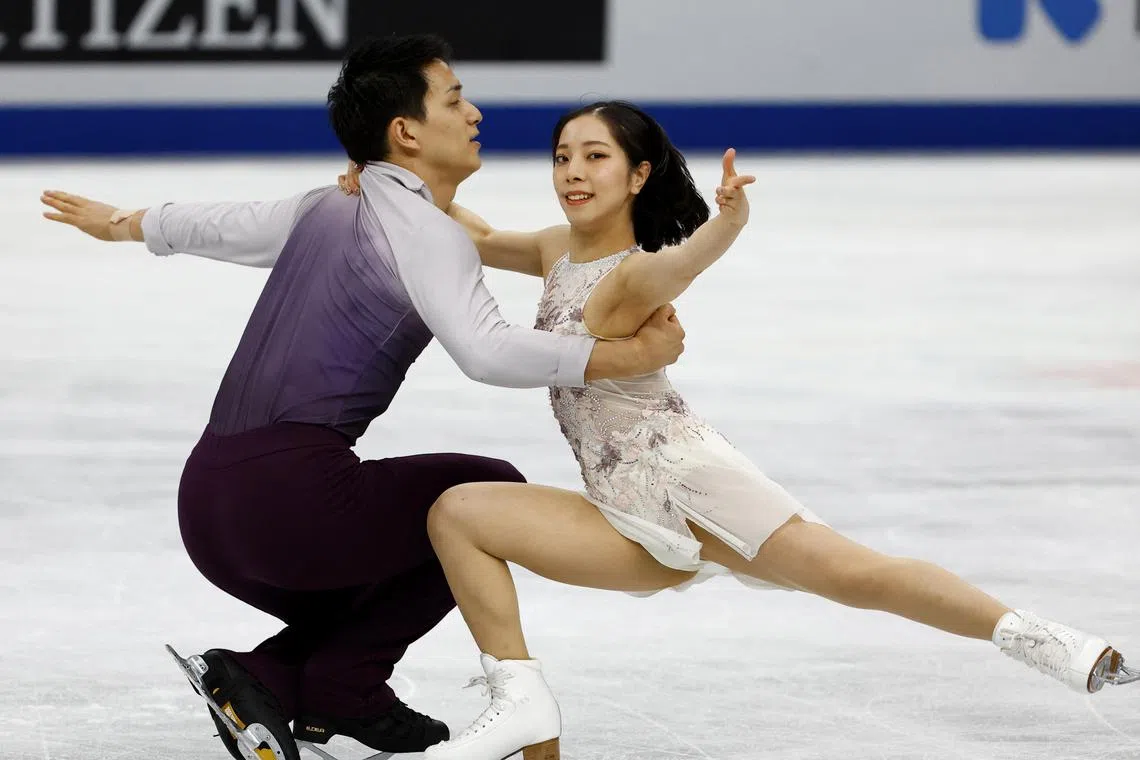 Japan's Riku Miura and Ryuichi Kihara perform during the pairs free skating.