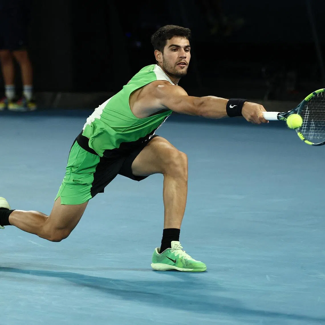 Tennis - Australian Open - Melbourne Park, Melbourne, Australia - January 27, 2026 Spain's Carlos Alcaraz in action during his quarter final match against Australia's Alex De Minaur REUTERS/Tingshu Wang