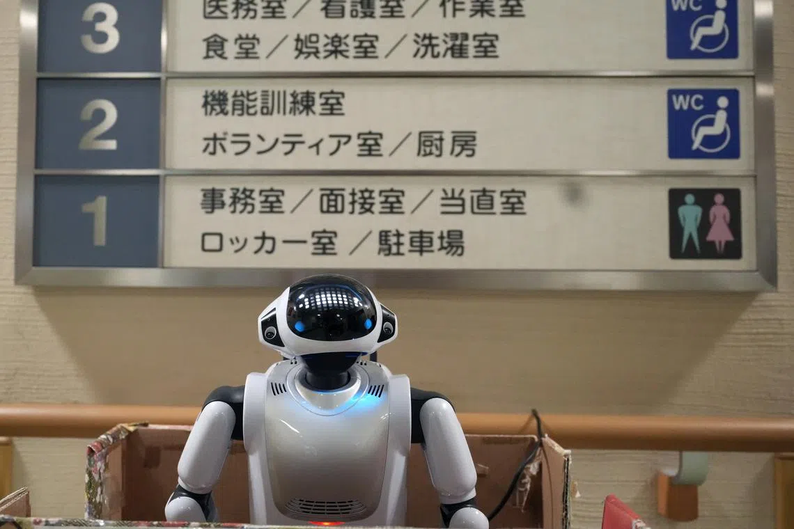 Communication robot Palro standing at the entrance of the Shintomi nursing home in Tokyo, Japan on April 7, 2023.