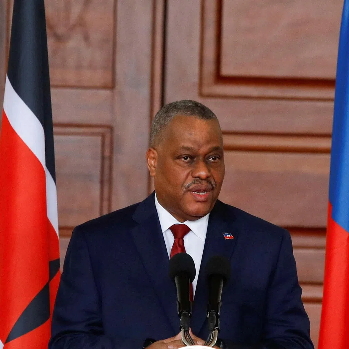 Haitian Prime Minister Garry Conille speaks during a joint press conference with Kenya's President William Ruto during his visit to the State House in Nairobi, Kenya, October 11, 2024. REUTERS/Monicah Mwangi