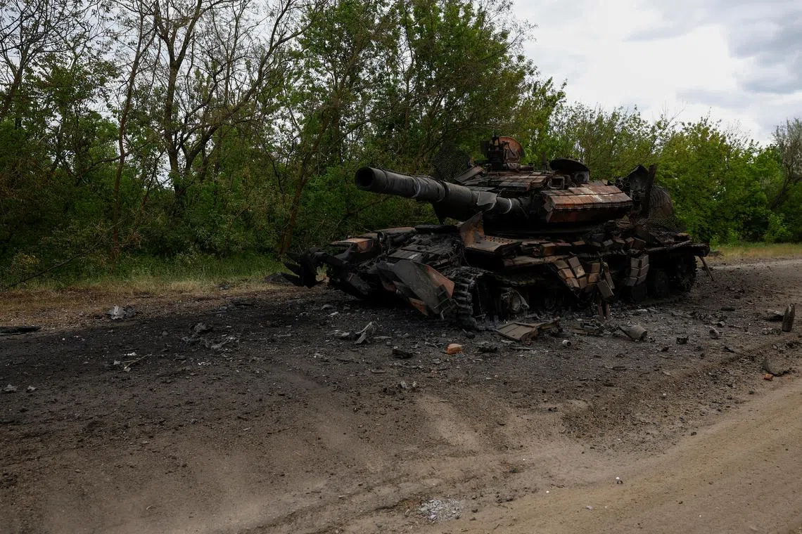 A destroyed tank is seen on a road, amid Russia's attack on Ukraine, in Kharkiv Region, Ukraine May 16, 2024. REUTERS/Valentyn Ogirenko