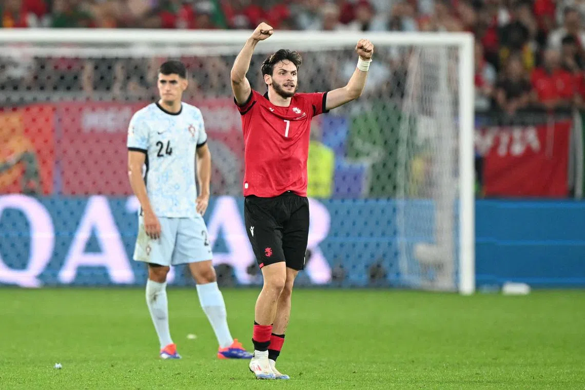 Georgia forward Khvicha Kvaratskhelia celebrating his team's second goal  during the Euro 2024 match against Portugal.