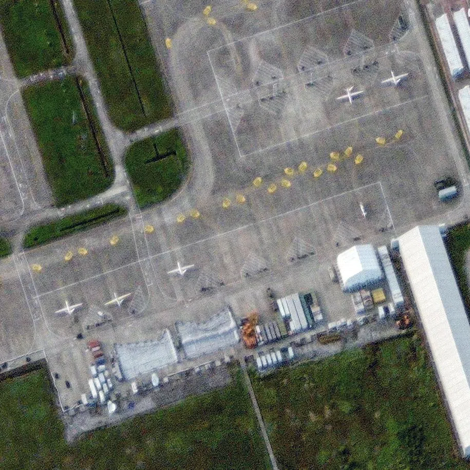 A satellite image shows large drones at Qionghai Boao International Airport on Hainan Island, China, September 3, 2025.    VANTOR/Handout via REUTERS