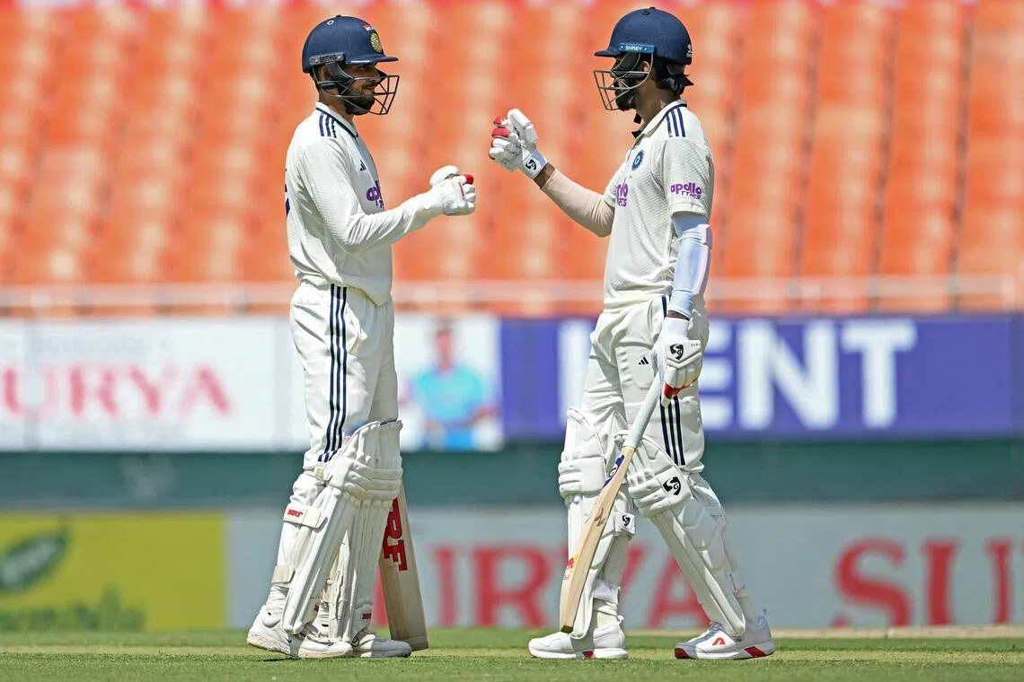 India's captain Shubman Gill (left) and K.L. Rahul bump fists on the first day of the only cricket Test against Afghanistan at the Maharaja Yadavindra Singh International Cricket Stadium on the outskirts of Chandigarh on June 6, 2026.