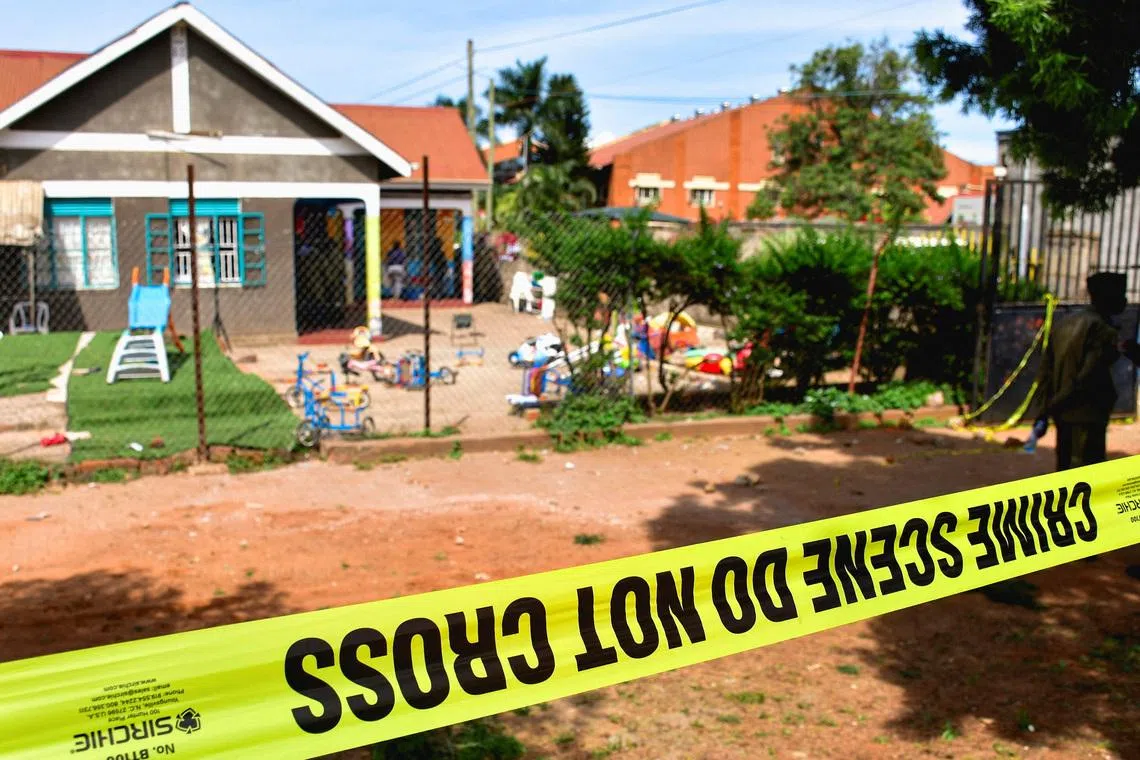 Police tape at the scene after a man posing as a parent stabbed and killed children at a school in Kampala, Uganda, April 2, 2026.