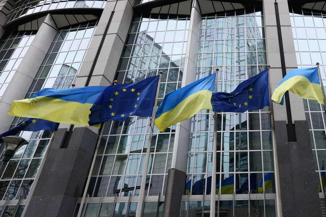 FILE PHOTO: Flags of Ukraine fly in front of the EU Parliament building on the first anniversary of the Russian invasion, in Brussels, Belgium February 24, 2023. REUTERS/Yves Herman/ FILE PHOTO