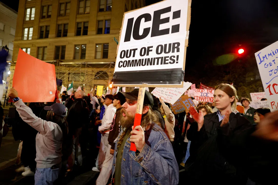 FILE PHOTO: People march in protest against federal authorities as they expand their crackdown on illegal immigration, in Raleigh, North Carolina, U.S. November 18, 2025.  REUTERS/Jonathan Drake/File Photo