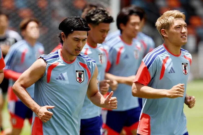 Japan's Takumi Minamino and Ritsu Doan during training on June 28 in Houston, Texas.