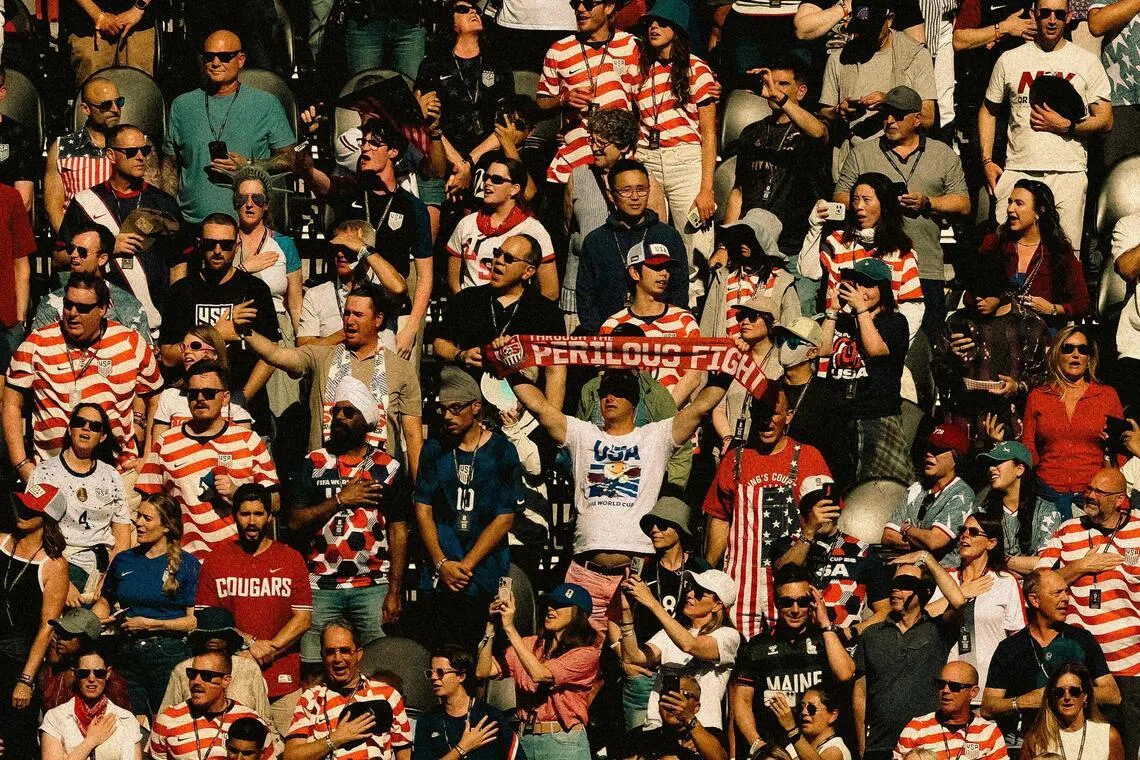 SEATTLE, WASHINGTON - JULY 06: (EDITOR'S NOTE: Tonal effects have been applied to this image) USA Fans stand for the national anthem during the FIFA World Cup 2026 Round Of 16 match between USA and Belgium at Seattle Stadium on July 06, 2026 in Seattle, Washington.   David Ramos/Getty Images/AFP (Photo by David Ramos / GETTY IMAGES NORTH AMERICA / Getty Images via AFP)