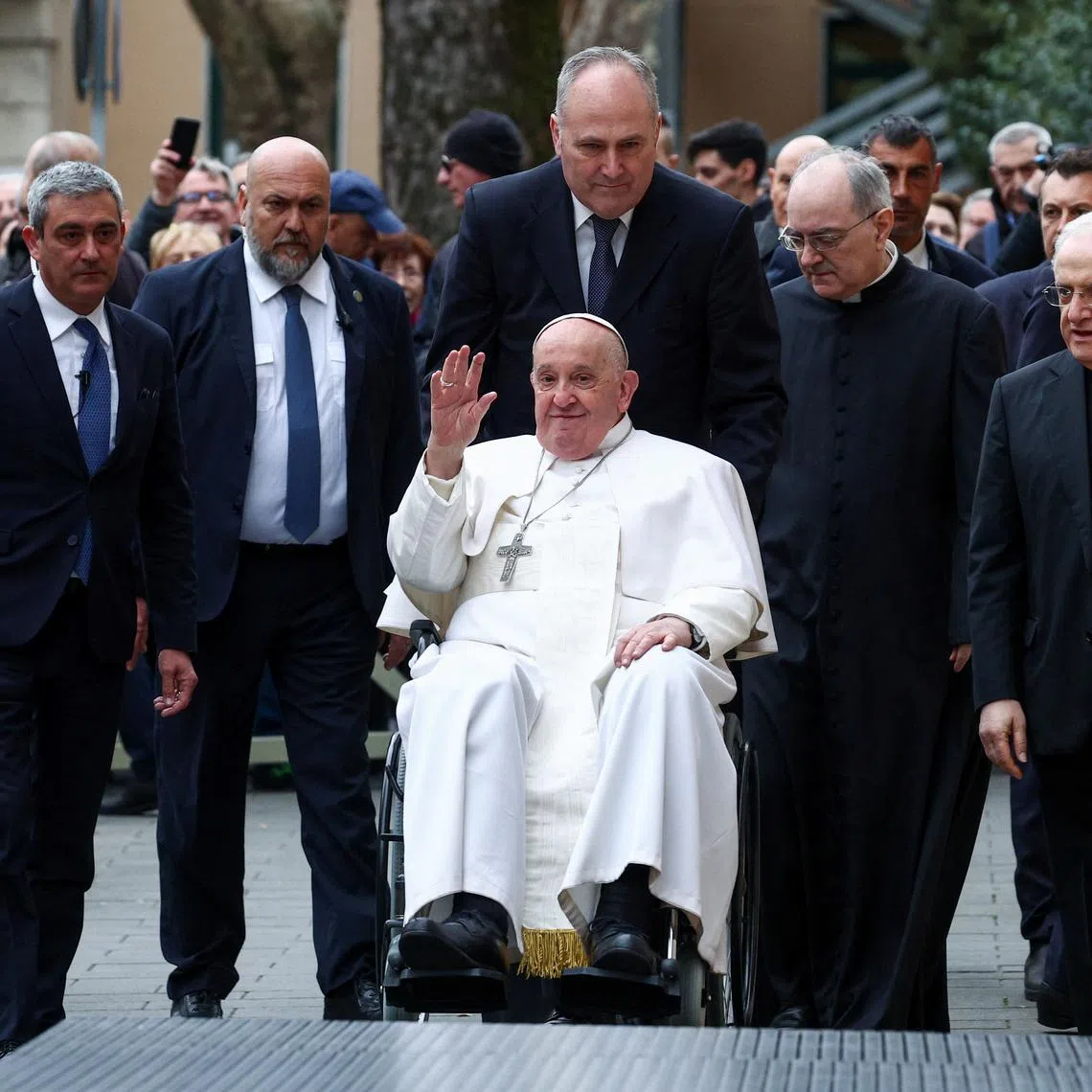 Pope Francis waves, on the day he presides over the '24 Hours for the Lord' Lenten initiative at the Roman parish of San Pio V, in Rome, Italy, March 8, 2024. REUTERS/Guglielmo Mangiapane