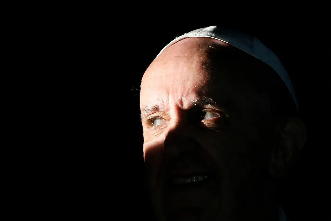 FILE PHOTO: Pope Francis looks on at the end of his pastoral visit at the parish church \"Santa Maria dell'Orazione\" at Setteville di Guidonia neighbourhood of Rome, March 16, 2014. REUTERS/Stefano Rellandini/File Photo