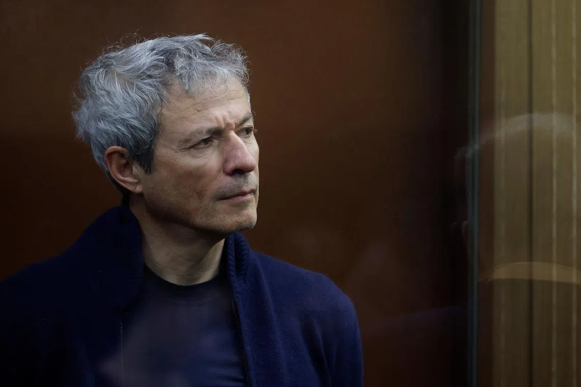 FILE PHOTO: Vadim Moshkovich, founder of the country's top agriculture company Rusagro, who is charged with fraud, stands inside a defendants' cage during a court hearing on his detention in Moscow, Russia March 27, 2025. REUTERS/Maxim Shemetov/File Photo