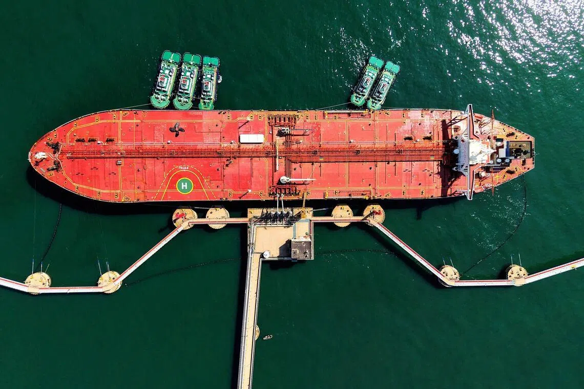 An oil tanker is docked unloading crude oil at the port in Qingdao, in China's eastern Shandong province, on April 7.