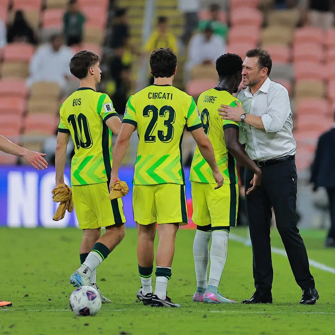 Soccer Football - World Cup - AFC Qualifiers - Group C - Saudi Arabia v Australia - King Abdullah Sports City Stadium, Jeddah, Saudi Arabia - June 10, 2025 Australia coach Tony Popovic celebrates with players after qualifying for the World Cup REUTERS/Stringer