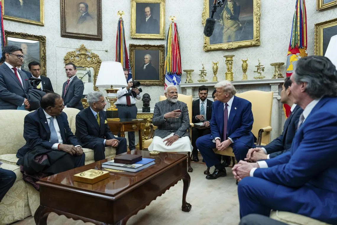 FILE — President Donald Trump with Prime Minister Narendra Modi of India during a meeting in the Oval Office of the White House in Washington, Feb. 13, 2025. With threats of tariffs up to 50 percent, President Trump seems to be scrapping America’s plan to turn India into a counterweight to China, declaring instead that it was a “dead economy.” (Eric Lee/The New York Times)
