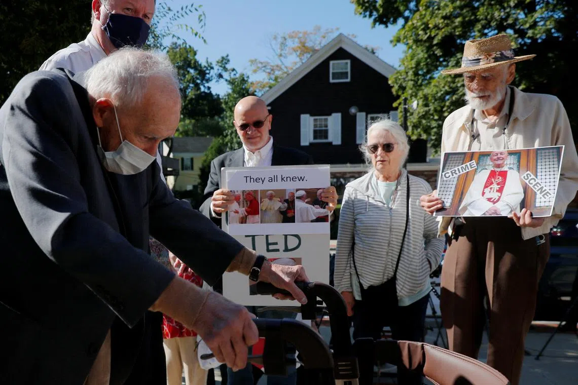 Former Roman Catholic Cardinal Theodore McCarrick passes victims of clergy sexual abuse at the district court in Dedham, Massachusetts, in 2021.