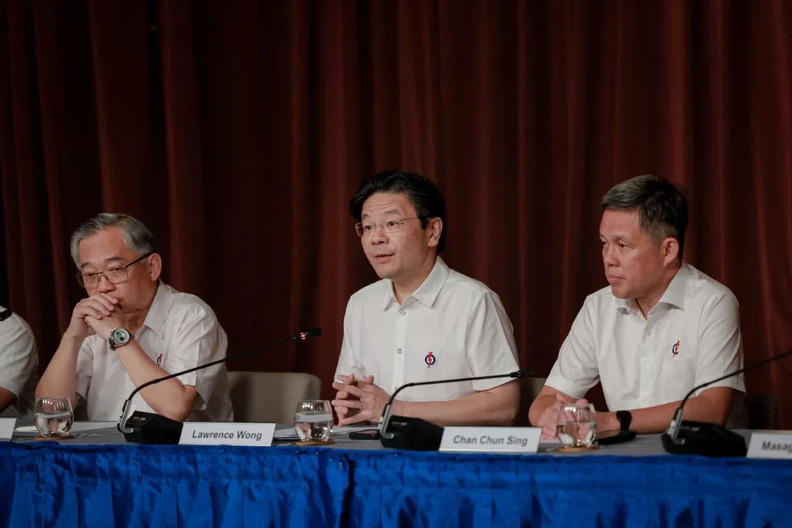 (From left) Deputy Prime Minister Gan Kim Yong, Prime Minister Lawrence Wong and Education Minister Chan Chun Sing at the media conference on May 4.