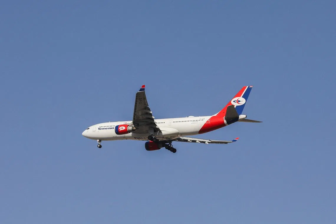 FILE PHOTO: A Yemenia - Yemen Airways Airbus A330-200 plane flies upon arrival at Sanaa Airport in Sanaa, Yemen September 30, 2023. REUTERS/Khaled Abdullah/File Photo