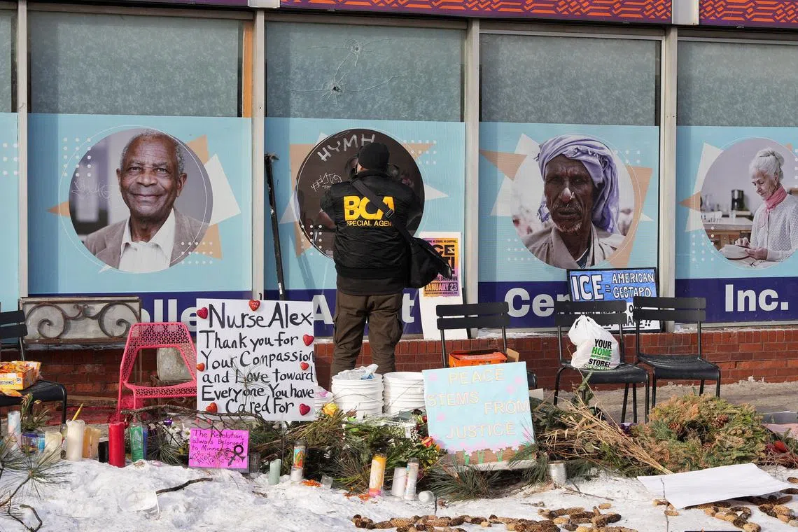 A member of the Bureau of Criminal Apprehension (BCA) works at the site where a man identified as Alex Pretti was fatally shot by federal immigration agents trying to detain him, in Minneapolis, Minnesota, U.S., January 25, 2026. REUTERS/Tim Evans
